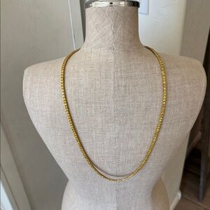 Long gold tone yellow CZ stone necklace